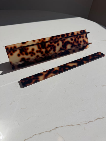 Mahj Mood tortoiseshell travel mahjong racks — acrylic rack pieces on marble surface, collapsible design