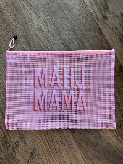Mahj Mama pink mesh tile bag on wood floor — mahjong tile storage bag for game nights and travel