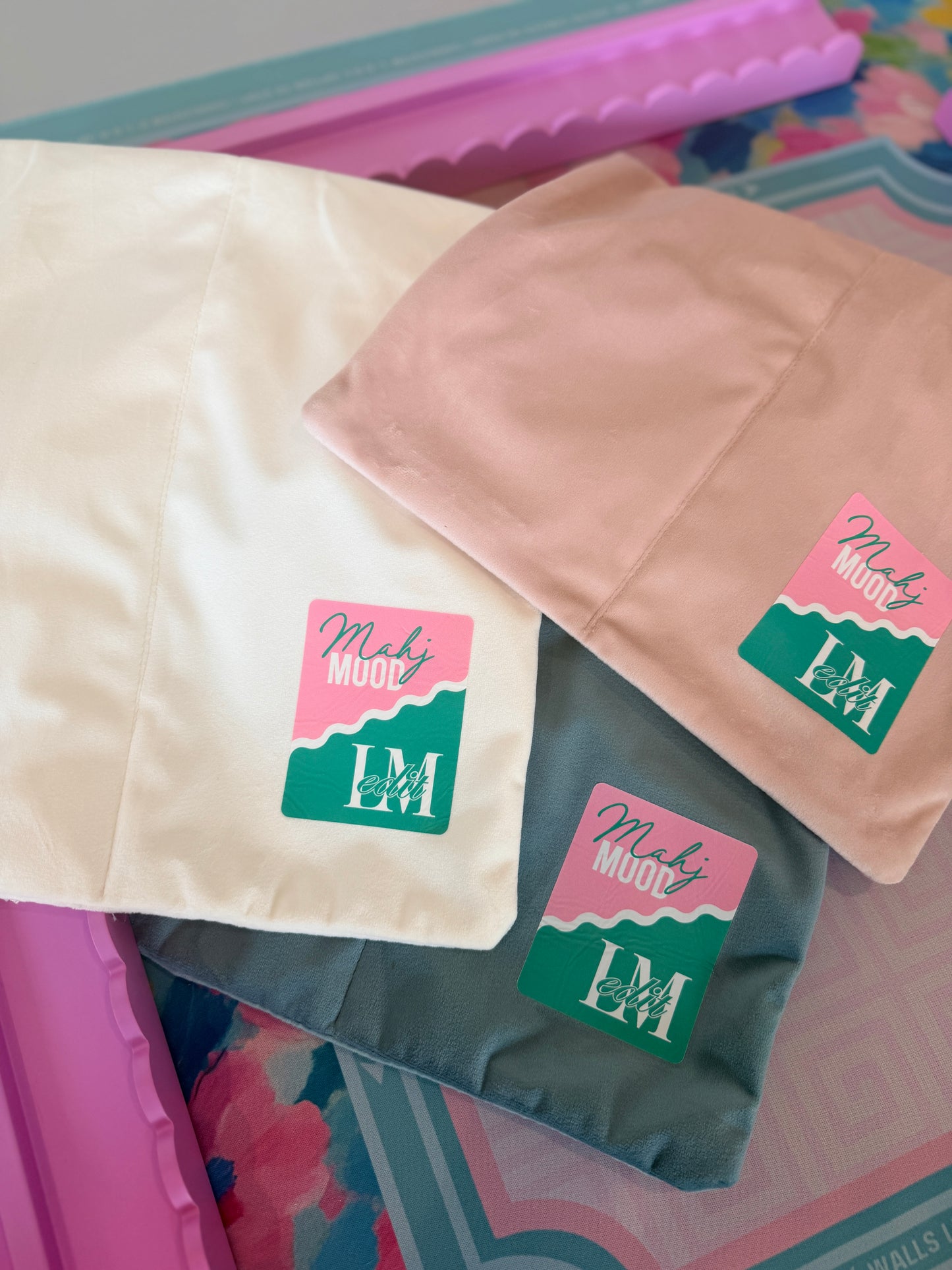 Velvet mahjong rack bags in white, pink, and blue with Mahj Mood x Larasmahjongedit collab patch logo