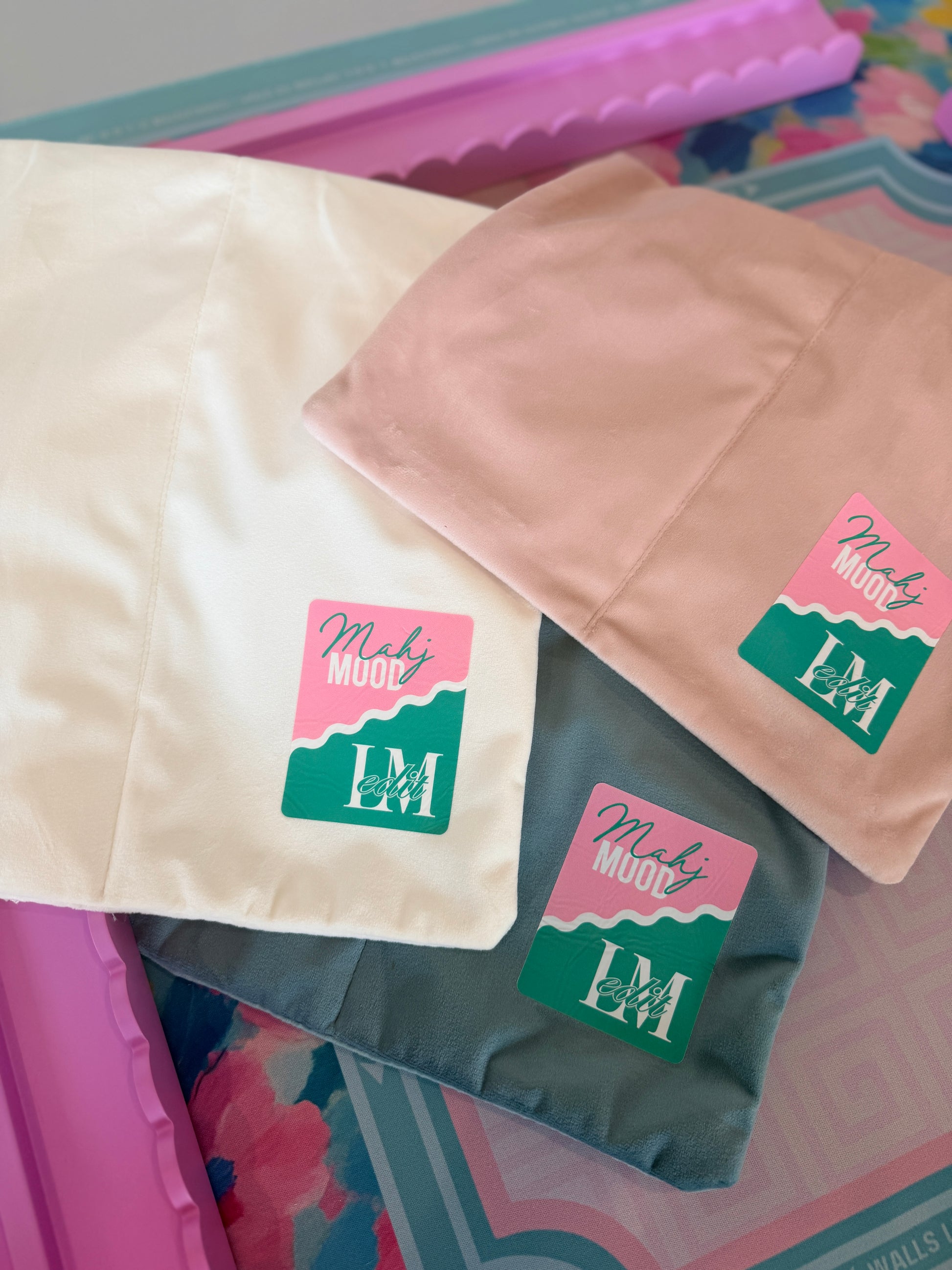 Velvet mahjong rack bags in white, pink, and blue with Mahj Mood x Larasmahjongedit collab patch logo